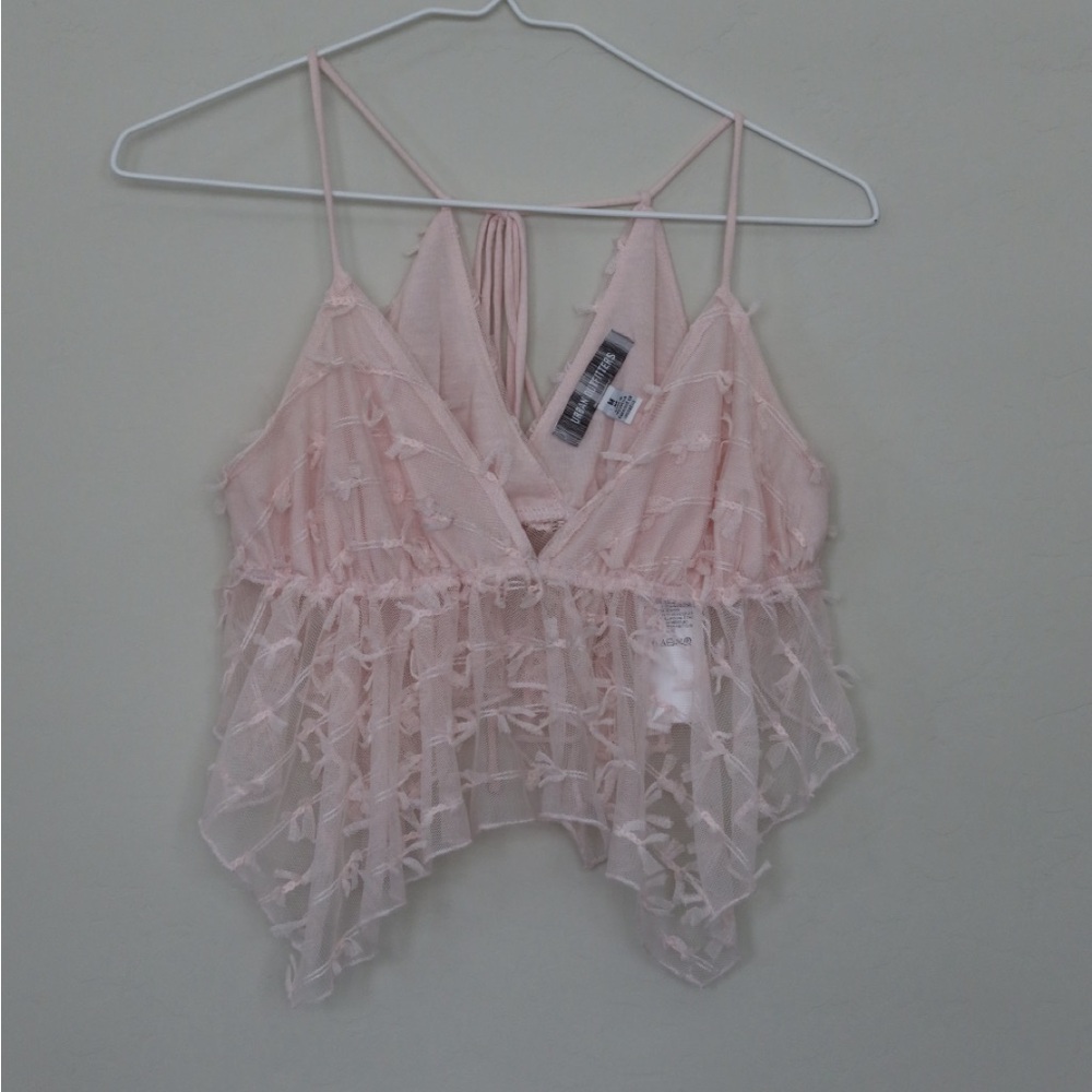 Urban Outfitters: baby pink frill bow tank top